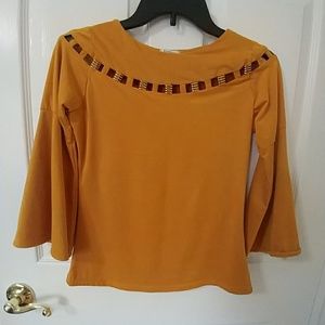 Bell sleeved yellow orange top.